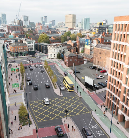 CGI showing the proposed street layout for Oldham Road looking south towards the Northern Quarter. There are bus lanes and cycle lanes added alongside high quality footways.
