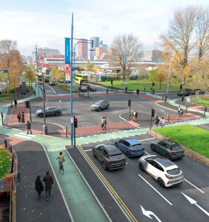 CGI showing the proposed street layout for Oldham Road showing a proposed Cyclops style junction. There are bus lanes and cycle lanes added alongside high quality footways.
